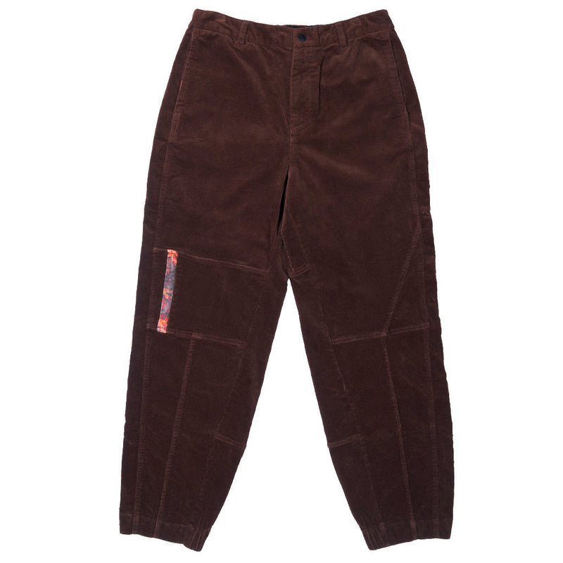 | full_frontal.JPG | Dark brown corduroy cargo pants with a colorful patterned fabric accent on the pocket, shown flat against a white background.