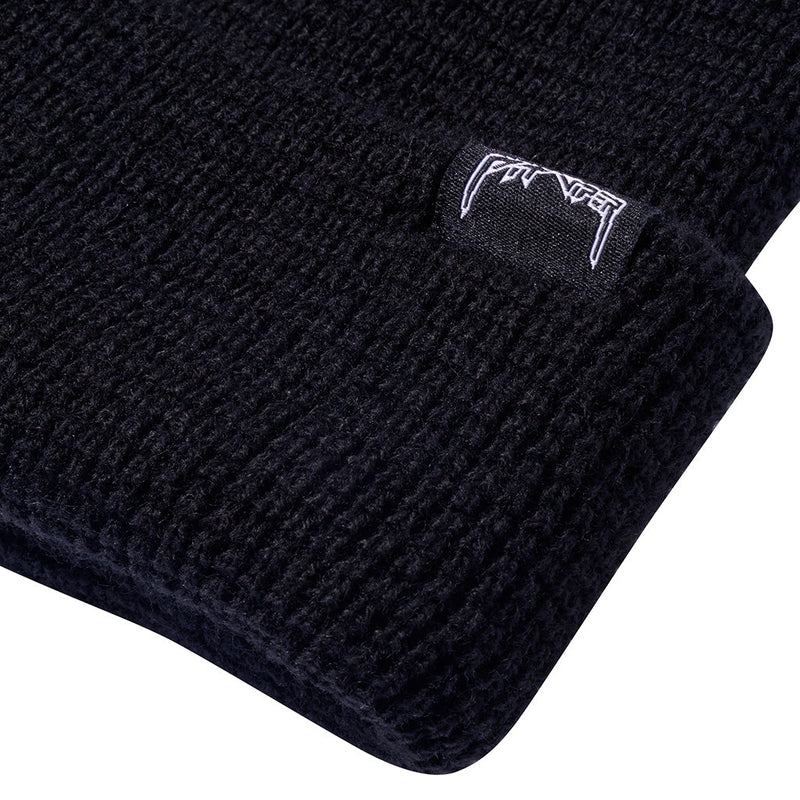| im_ready_for_my_closeup.JPG | Close-up of a black beanie with white embroidery on a white background