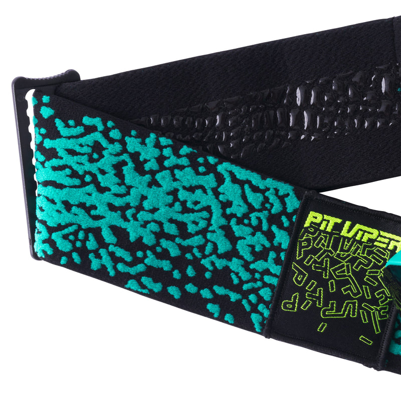 HDPV Smoke | it_a_strap.JPG | A close-up of a black athletic belt with a vibrant turquoise and black abstract pattern on the front, featuring a black buckle and a black hook-and-loop patch with neon yellow-green text that reads 'Pit Viper!'.
