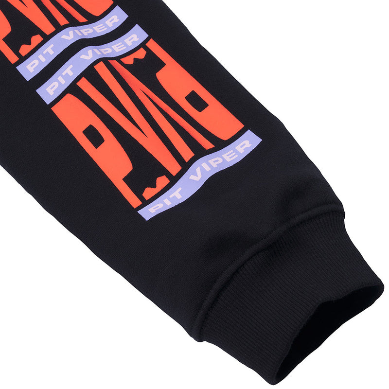 | detail_shot.JPG | Close-up of a black sweatshirt sleeve featuring a bold graphic print with large orange letters and lavender-blue banners reading 'PIT VIPER'.