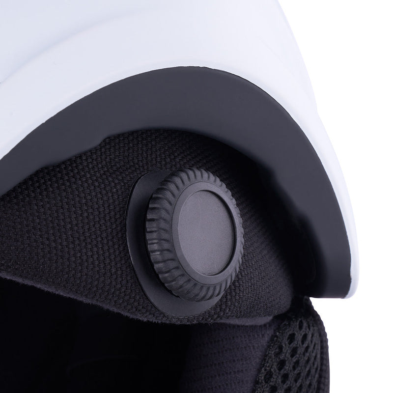 | dial_up.JPG | Close-up of a white and black helmet interior showing the adjustable black ventilation valve and textured fabric lining.