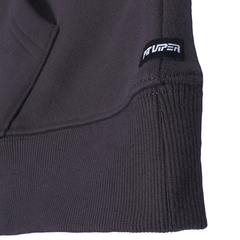 | detail_shot.JPG | Close-up of a dark charcoal gray ribbed knit garment, showing a small black brand patch with white 'Pit Viper' text on the sleeve.