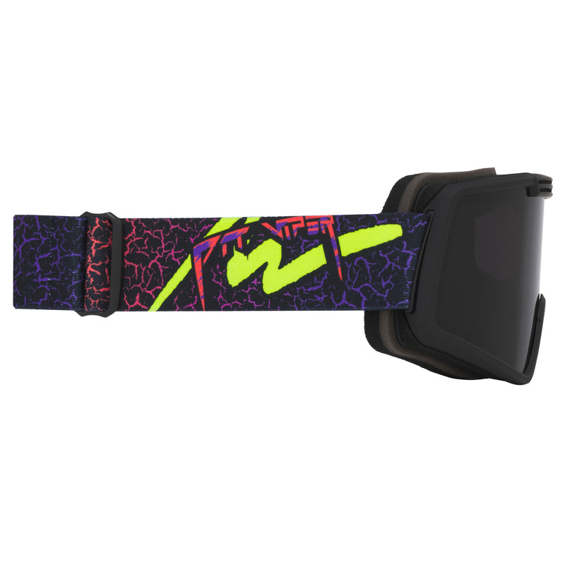 Smoke / Small | even_more_side_view.JPG | Goggles with a black frame and a highly vibrant, multicolor patterned strap featuring neon green, purple, pink, and black crackle graphics.