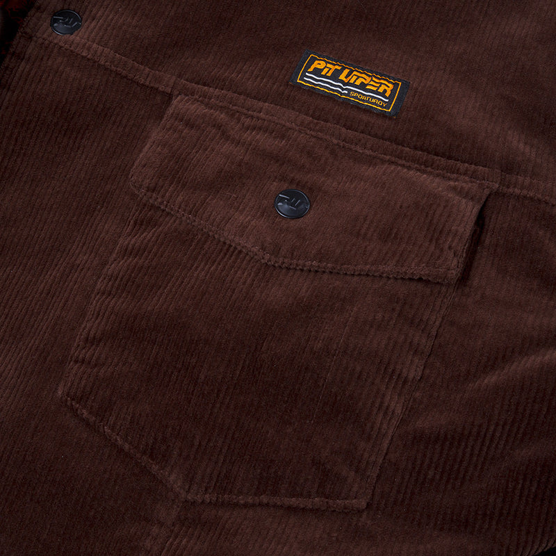 | pocket.JPG | Close-up of a brown corduroy work jacket showing a front pocket with a snap tab and a small visible Pit Viper brand patch.