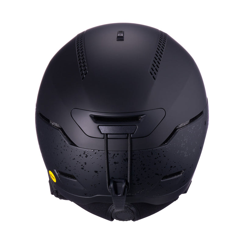 | it_the_back.JPG | Matte black ski helmet shown from the back, featuring a textured lower section, ventilation slots, and a small yellow sticker on the side, set against a plain white background.