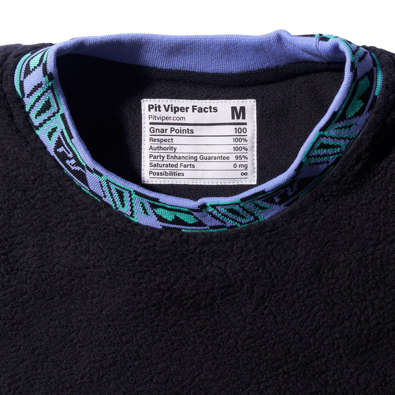| detail_shot.JPG | Close-up of a black fleece crewneck sweatshirt with a patterned purple and teal collar, featuring a white 'Pit Viper Facts' label inside the collar.