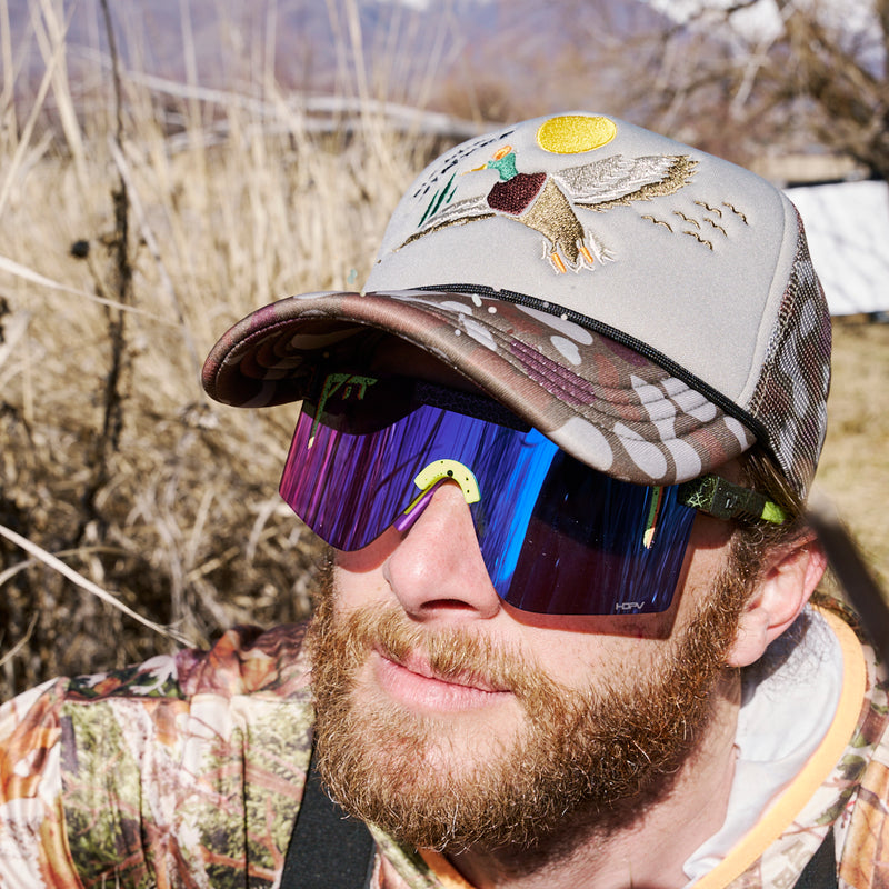 | photo_of_person_2.JPG | A photo of a person wearing the Duck Hunt hat from Pit Viper