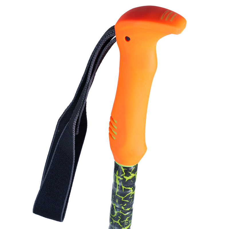 Close-up of a ski pole handle with a bright orange ergonomic grip, a black wrist strap, and a dark green and black camouflage-patterned shaft on a white background.