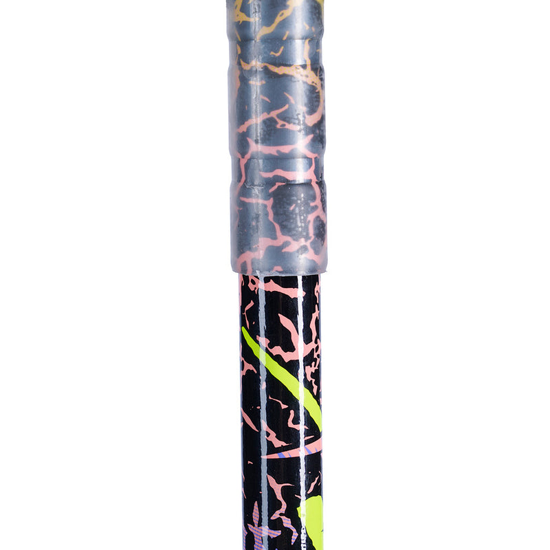Close-up of a ski pole, featuring a black base with pink and orange crackle-style graphics and a bright neon yellow-green accent stripe.