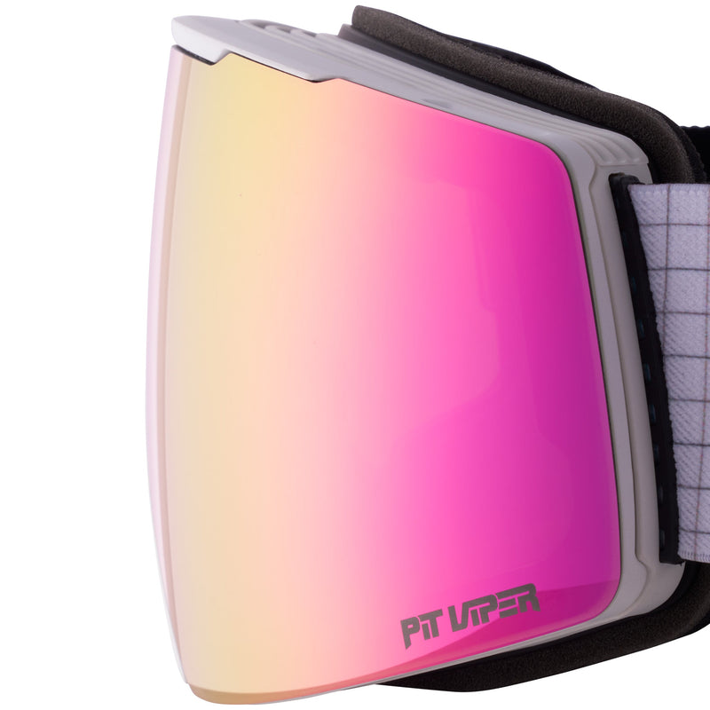 Pink | toric_lens.JPG | Close-up of ski or snowboard goggles with a large mirrored lens showing a pink-to-yellow gradient, a gray frame, black padding, and a white-and-gray strap. The brand name 'PIT Viper' is printed on the lower right of the lens.