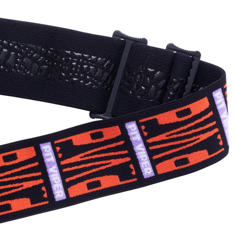 / Smoke | its_a_strap.JPG | A close-up of a black elastic goggle strap with a textured snake skin pattern on the underside and a woven strap featuring orange tiger-stripe graphics and purple vertical 'PIT VIPER' text, shown on a white background.