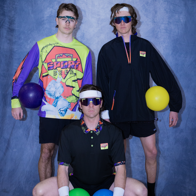 Photo of athletes wearing sport beer products against a photo background also wearing Pit Viper Sunglases.