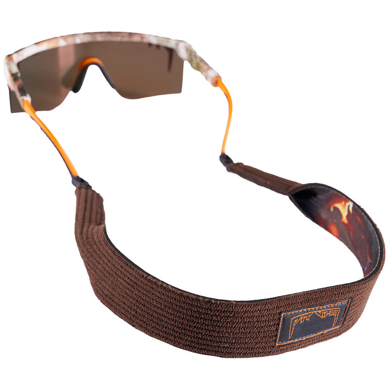 | nice.JPG | A pair of shield-style sunglasses with a brown elastic strap and orange accents, shown on a plain white background.