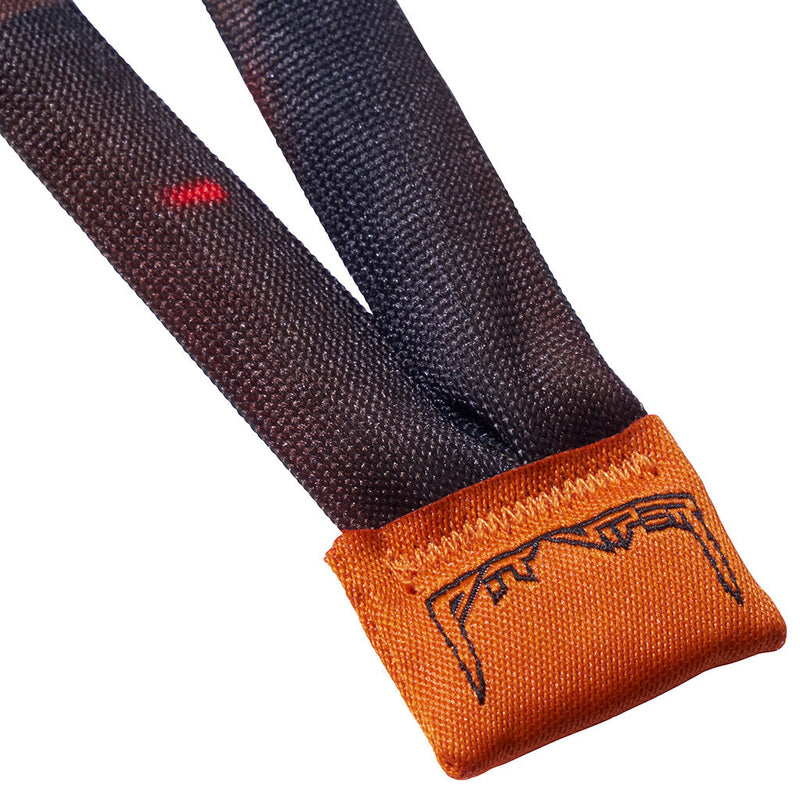 | im_ready_for_my_closeup.JPG | Close-up of a dark charcoal gray webbed strap with a bright orange fabric end cap featuring a black embroidered stylized logo.