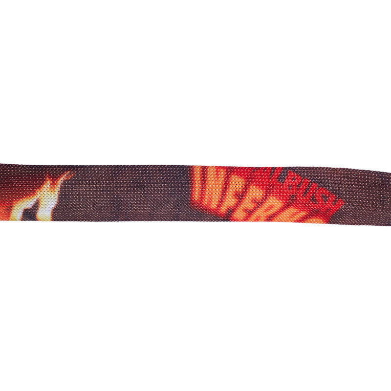 | inferno.JPG | A close-up horizontal view of a dark woven strap or belt featuring a red and orange graphic with the word 'INFERNO' and flame motifs on a plain white background.