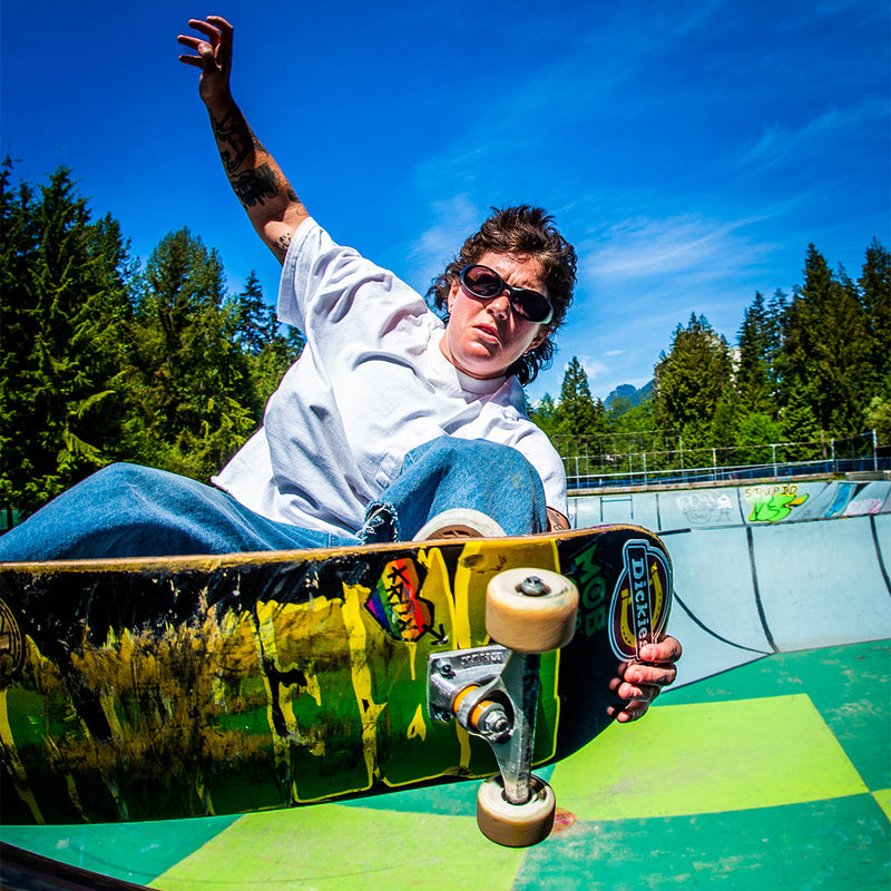 Silver | photo_of_person.JPG | Woman skateboarding wearing The Spine Tingler Slammer from Pit Viper Sunglasses