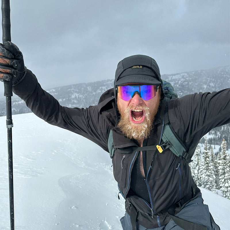 / Smoke | photo_of_person_2.JPG | Man in the snow wearing The Exec Try-Hard from Pit Viper Sunglasses