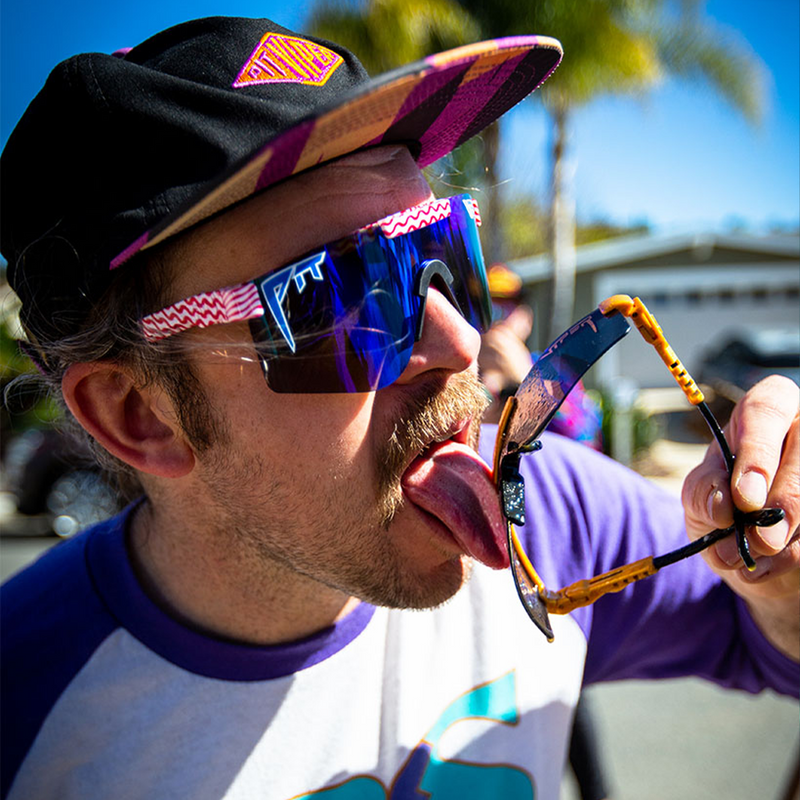 Polarized Blue / Narrow | wow.JPG | Man licking Pit Viper Sunglasses while wearing The Yankee Noodle Original from Pit Viper Sunglasses